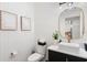 Stylish powder room with herringbone wallpaper and a vessel sink at 10160 Mallard Landings Way, Orlando, FL 32832