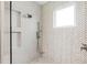Modern tiled shower with dual shower heads and built in shelving at 10160 Mallard Landings Way, Orlando, FL 32832