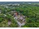 A forested, aerial view of condo community with parking spaces in a desirable neighborhood at 1017 Love Ln # 34, Apopka, FL 32703