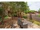 Private backyard featuring a brick patio with seating and a quaint yard, ideal for relaxation at 1017 Love Ln # 34, Apopka, FL 32703