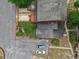 Aerial view of backyard with deck, parking, and greenery perfect for relaxing and entertaining outdoors at 1017 Love Ln # 34, Apopka, FL 32703