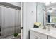 Bathroom featuring vanity with single sink, shower with patterned curtain, and mirrored medicine cabinet at 1017 Love Ln # 34, Apopka, FL 32703