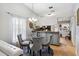 Cozy dining area with modern chandelier and direct access to kitchen at 1017 Love Ln # 34, Apopka, FL 32703