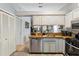 Updated kitchen featuring stainless steel dishwasher, light gray cabinets and butcher block countertops at 1017 Love Ln # 34, Apopka, FL 32703