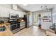 Well-equipped kitchen with stainless steel appliances, tile flooring, and ample counter space at 1017 Love Ln # 34, Apopka, FL 32703