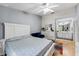 Spacious main bedroom with hardwood floors, ceiling fan, sitting area, and an ensuite bathroom at 1017 Love Ln # 34, Apopka, FL 32703