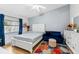 Bright main bedroom with hardwood floors, ceiling fan, and window with blue drapes at 1017 Love Ln # 34, Apopka, FL 32703