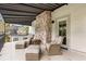 Exterior balcony featuring wicker seating and beautiful brickwork at 104 Cortland Ave, Winter Park, FL 32789