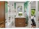 Stylish bathroom with unique wallpaper, a tub and shower, and a vanity for storage at 104 Cortland Ave, Winter Park, FL 32789