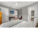 Neutral bedroom featuring a ceiling fan and doorway to bathroom at 104 Cortland Ave, Winter Park, FL 32789