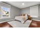 Neutral bedroom with hardwood floors, area rug, and natural light at 104 Cortland Ave, Winter Park, FL 32789