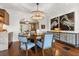 Elegant dining room features stylish lighting, heron artwork and a bar with a buffet at 104 Cortland Ave, Winter Park, FL 32789