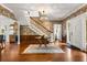 A grand two story foyer featuring beautiful wallpaper and a staircase to the second floor at 104 Cortland Ave, Winter Park, FL 32789