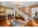 Inviting foyer features designer wallpaper, hardwood floors, and access to the dining and living spaces at 104 Cortland Ave, Winter Park, FL 32789