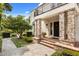 Inviting front entrance with brick columns, landscaped garden, and stone walkway at 104 Cortland Ave, Winter Park, FL 32789
