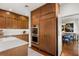 Kitchen with stainless appliances and custom cabinets flowing into the dining area at 104 Cortland Ave, Winter Park, FL 32789