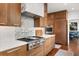 Updated kitchen features stainless appliances, gas range, stylish hood and butcher block accents at 104 Cortland Ave, Winter Park, FL 32789