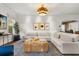 Cozy living room featuring plush seating, designer rug, and modern decor at 104 Cortland Ave, Winter Park, FL 32789
