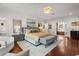 Expansive main bedroom featuring wood floors, luxury furniture, and bright decor at 104 Cortland Ave, Winter Park, FL 32789