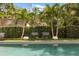 Chairs by the pool, creating a relaxing and picturesque outdoor space perfect for enjoying sunny days and outdoor living at 104 Cortland Ave, Winter Park, FL 32789