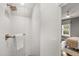 White shower stall featuring white tile and gold fixtures at 104 Cortland Ave, Winter Park, FL 32789