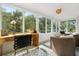 Bright sunroom with large windows, patterned tile floor, and stylish furnishings at 104 Cortland Ave, Winter Park, FL 32789