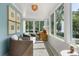 Bright sunroom with large windows, patterned tile floor, and stylish furnishings at 104 Cortland Ave, Winter Park, FL 32789