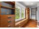 Walk-in closet with custom shelving, cabinets, and a window at 104 Cortland Ave, Winter Park, FL 32789