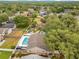 Bird's eye view of property featuring a pool and lush surroundings at 1040 Big Oaks, Oviedo, FL 32765