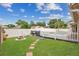 Backyard with lush grass, pool and a small fire pit at 1040 Big Oaks, Oviedo, FL 32765