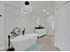 Modern bathroom featuring a soaking tub, marble accent wall, and double vanity at 1040 Big Oaks, Oviedo, FL 32765