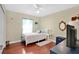 Bedroom features a ceiling fan, wood floors, and one twin bed at 1040 Big Oaks, Oviedo, FL 32765