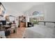 Bright bedroom with a large window, desk, and wood-look flooring at 1040 Big Oaks, Oviedo, FL 32765