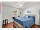 Bedroom with a wood-style bed frame, ceiling fan, and hardwood floors at 1040 Big Oaks, Oviedo, FL 32765
