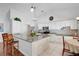 Well-lit kitchen featuring granite counters, a center island, and stainless steel appliances at 1040 Big Oaks, Oviedo, FL 32765