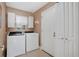 Laundry room featuring a washer, dryer, and cabinet space at 1040 Big Oaks, Oviedo, FL 32765