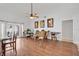 Open-concept living area featuring hardwood floors, a ceiling fan, and access to an outdoor area at 1040 Big Oaks, Oviedo, FL 32765