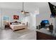 Spacious bedroom featuring vaulted ceiling, ceiling fan, and natural light at 1040 Big Oaks, Oviedo, FL 32765