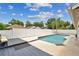 A backyard pool is surrounded by a white fence and a small deck with built-in seating at 1040 Big Oaks, Oviedo, FL 32765