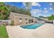 Backyard pool and covered patio with seating, a tranquil outdoor living space at 1040 Big Oaks, Oviedo, FL 32765