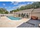 A backyard pool and covered patio create a relaxing outdoor living space at 1040 Big Oaks, Oviedo, FL 32765