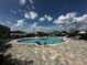 Resort-style community pool featuring spacious lounge areas and a Gathering-friendly environment for relaxation at 1141 Lakeshore Breeze Pl, Kissimmee, FL 34747