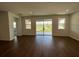 Bright living room with a sliding glass door leading to the backyard with a scenic view at 1141 Lakeshore Breeze Pl, Kissimmee, FL 34747