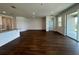 Spacious living room with hardwood floors, sliding glass doors, and recessed lighting at 1141 Lakeshore Breeze Pl, Kissimmee, FL 34747