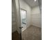 Walk-in closet featuring shelving and a view into the bathroom at 1141 Lakeshore Breeze Pl, Kissimmee, FL 34747