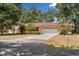 Charming single-story home with a well-maintained lawn and a two-car garage at 1190 Pecan St, Kissimmee, FL 34744