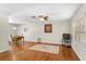 Spacious living room boasts wood floors, ceiling fan, and ample natural light at 1190 Pecan St, Kissimmee, FL 34744