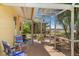 Enclosed patio featuring a seating area and offering a view of the surrounding landscape at 1190 Pecan St, Kissimmee, FL 34744