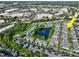 Charming townhome community featuring a central pond, community pool, and mature landscaping at 12661 Somerset Oaks St, Orlando, FL 32828