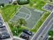 Community basketball court featuring parking and nearby mature landscaping at 12661 Somerset Oaks St, Orlando, FL 32828